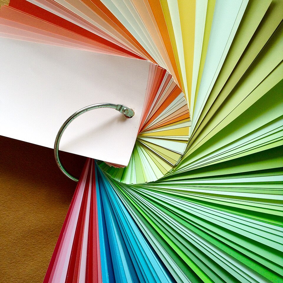 Rainbow paint swatches fanned in a circle